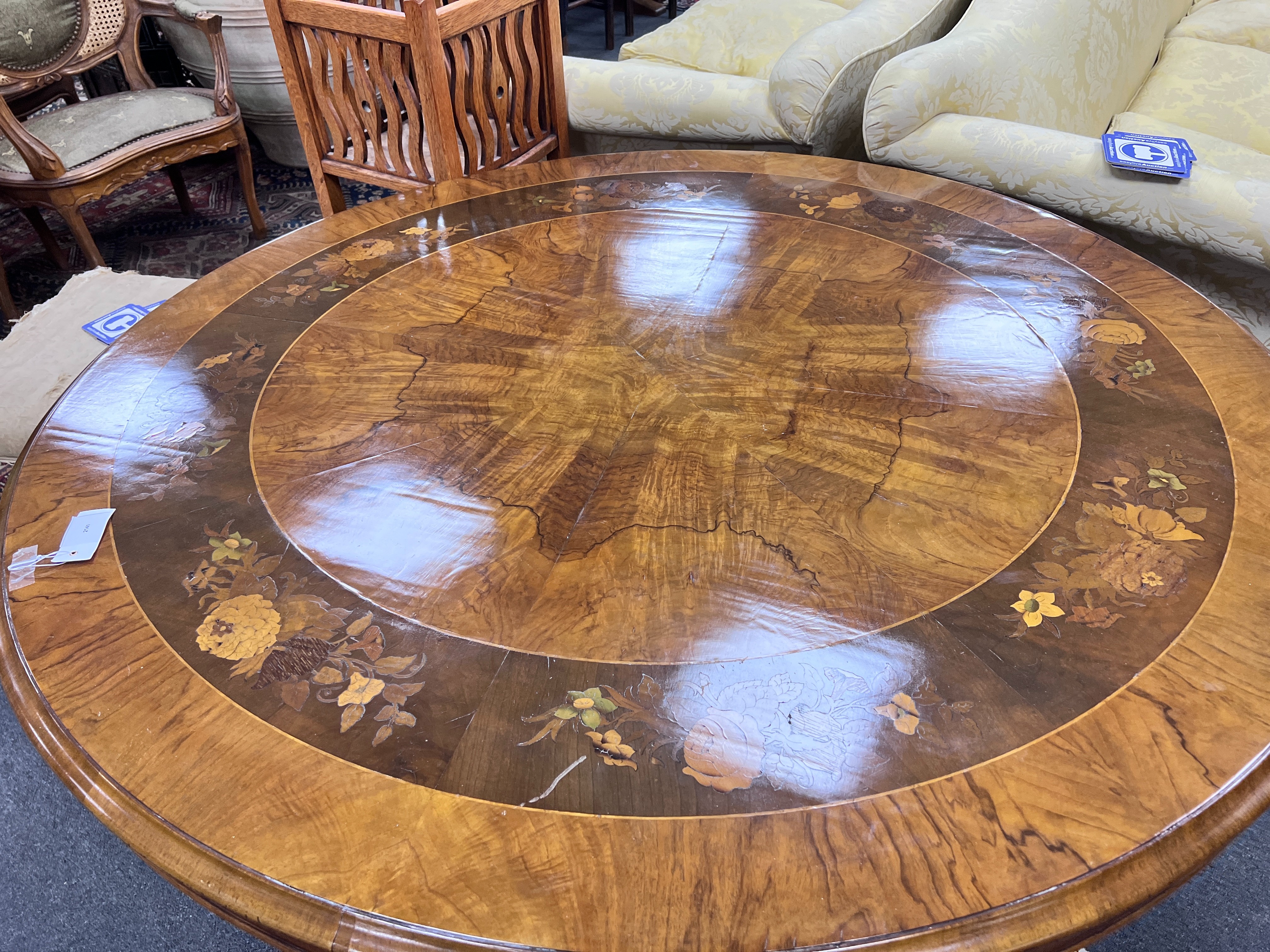 A Victorian floral marquetry inlaid figured walnut circular tilt top breakfast table, diameter 126cm, height 70cm